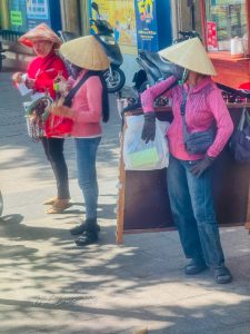 The ubiquitous conical hats are traditional accessory to shield from the sun